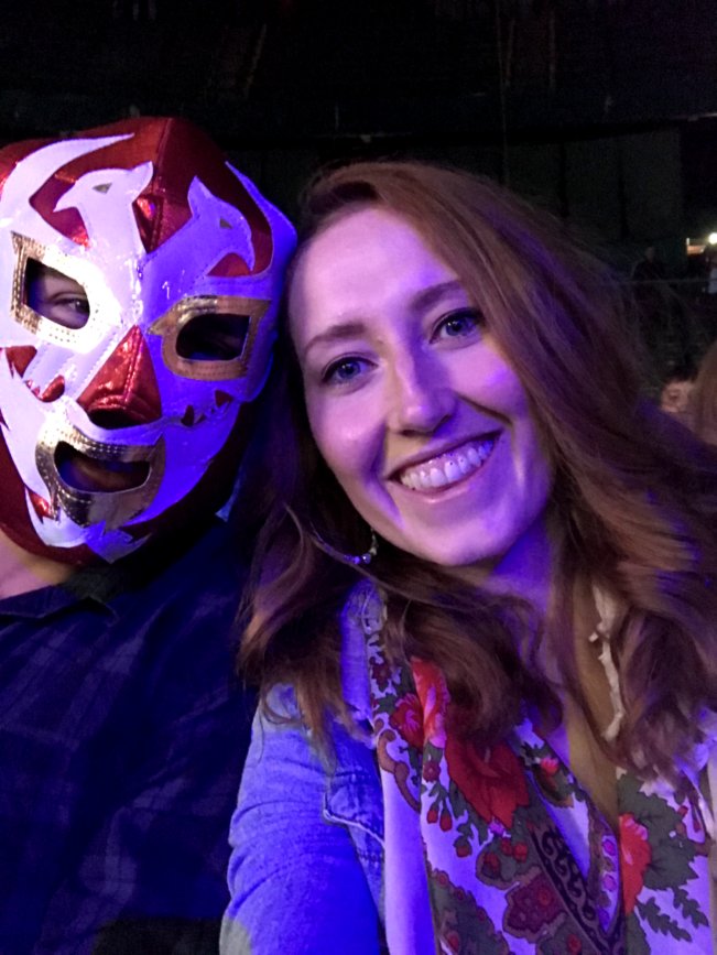 Women and Man looking to camera. Man wearing Mexican wrestling mask.